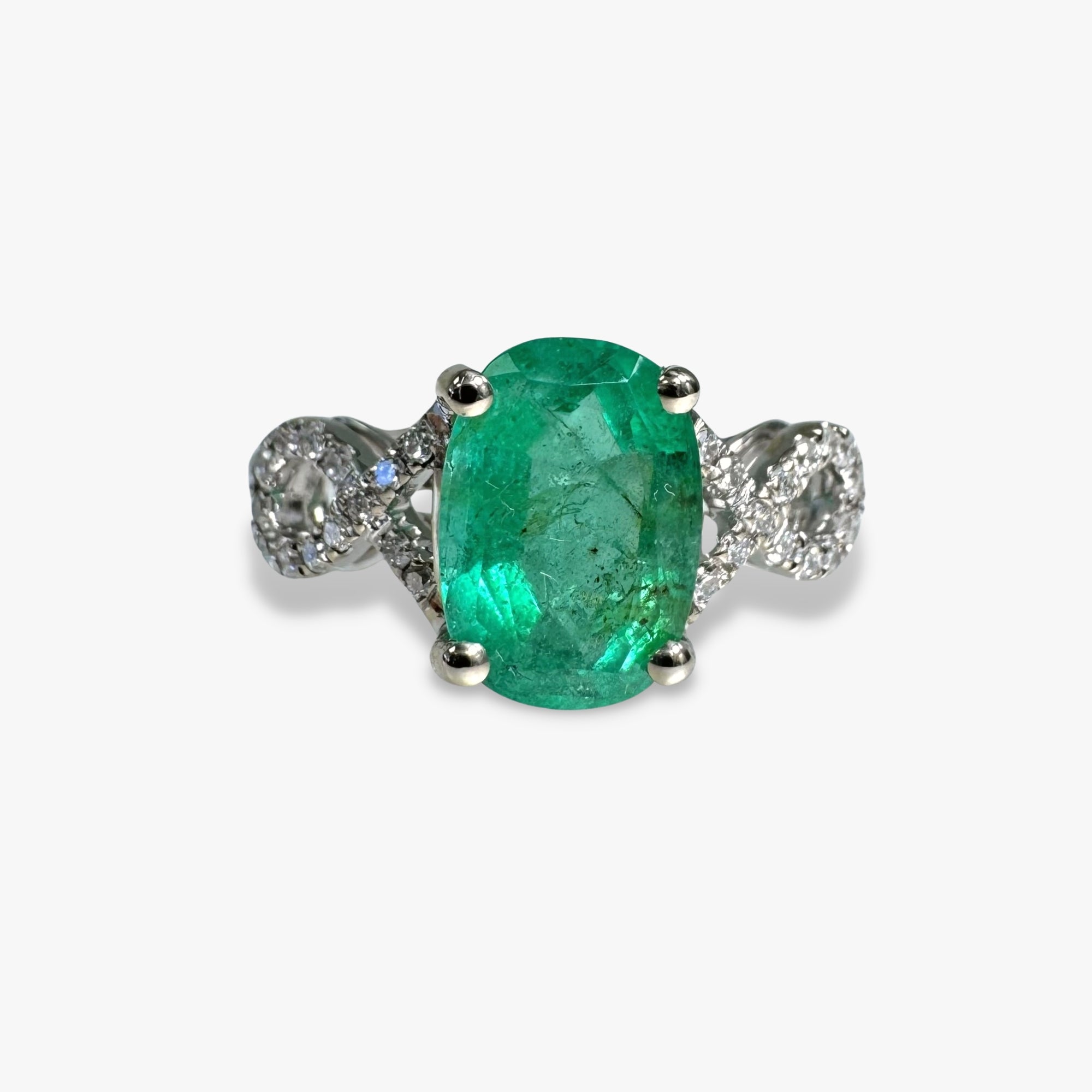 14k White Gold Oval Cut Emerald and Diamond Twisted Shank Ring