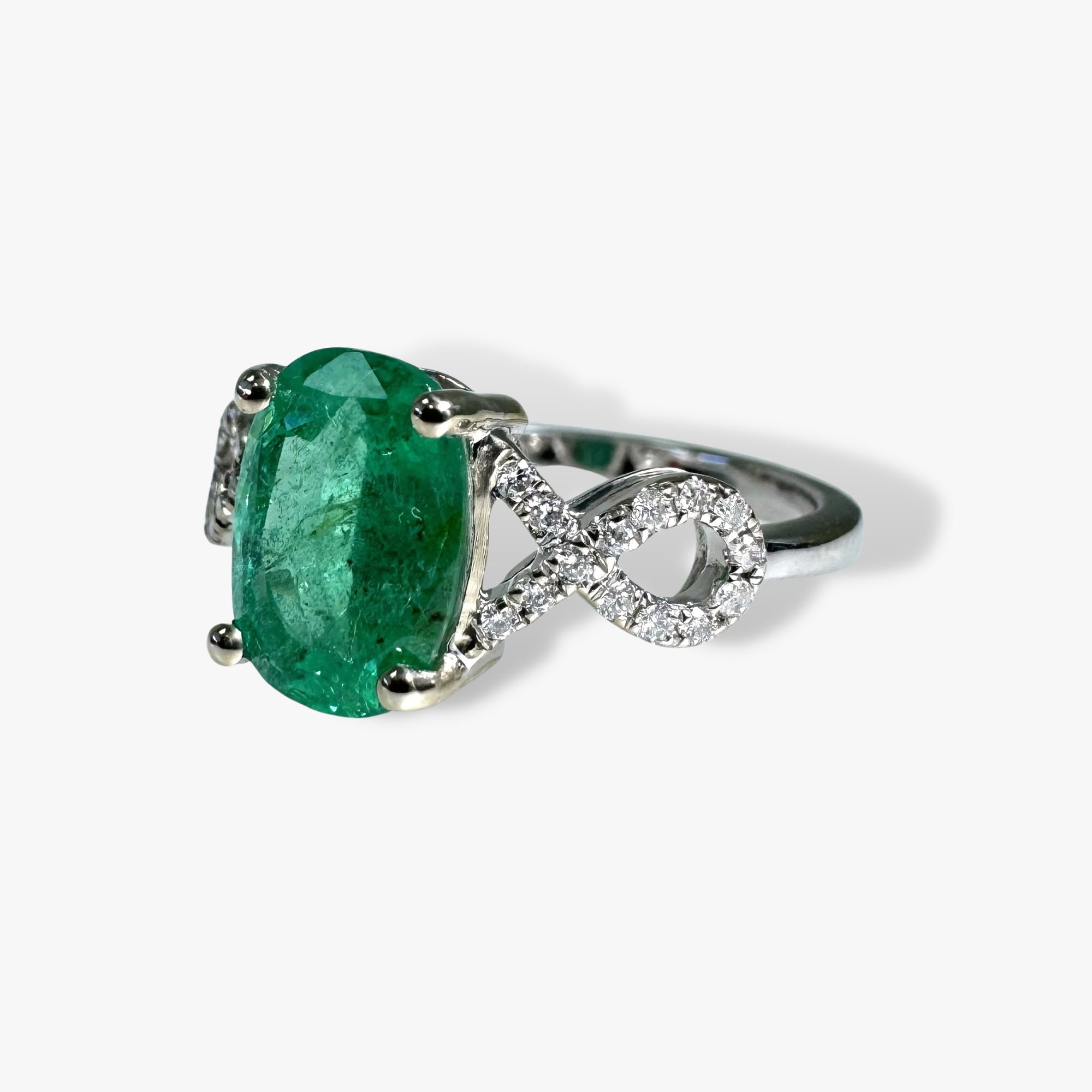 14k White Gold Oval Cut Emerald and Diamond Twisted Shank Ring Side View