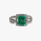 18k White Gold Emerald Cut Emerald and Diamond Halo Twisted Ring