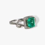 18k White Gold Emerald Cut Emerald and Diamond Halo Twisted Ring Side View
