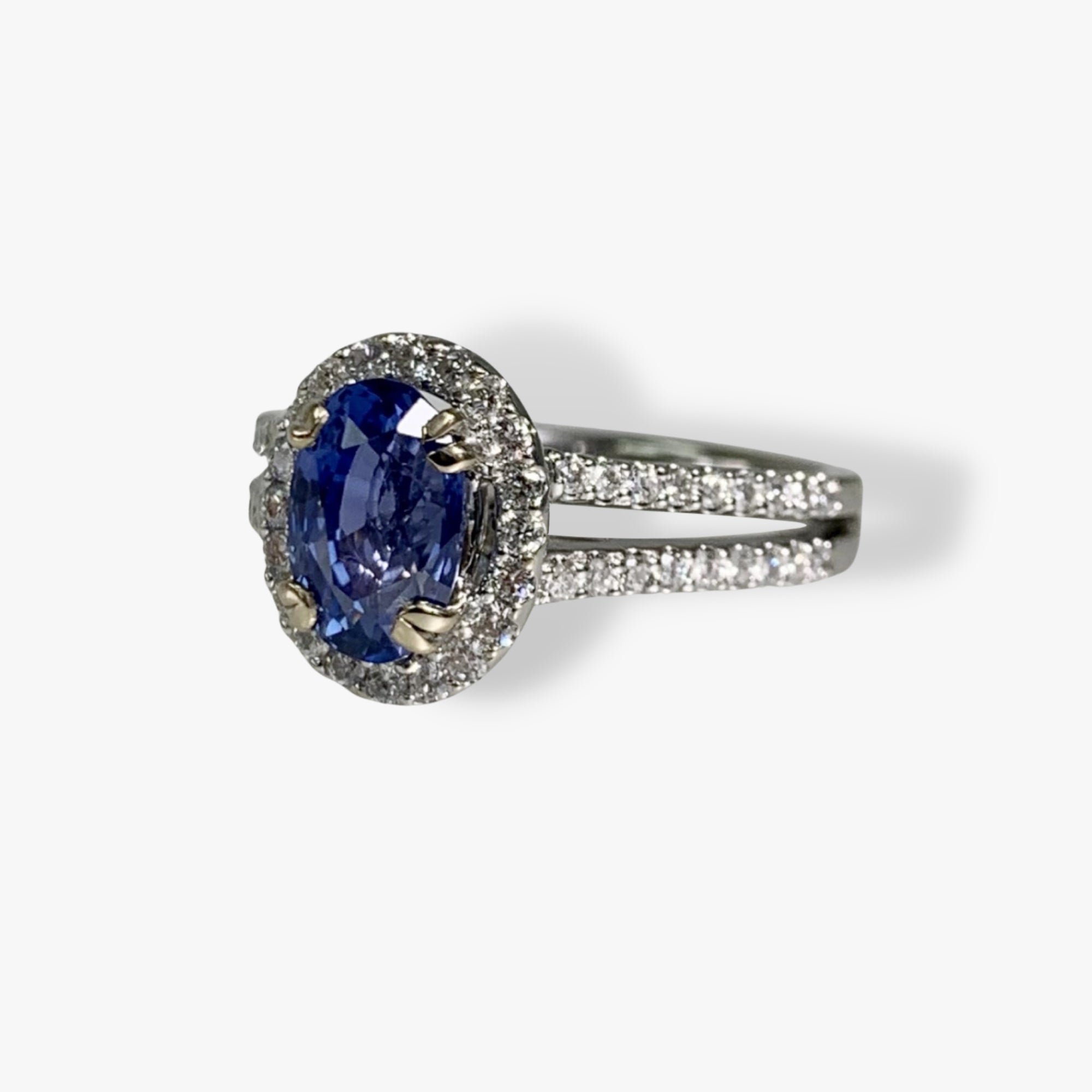 18k White Gold Oval Cut Blue Sapphire Diamond Halo Split Shank Ring Side View