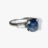 14k White Gold Round Blue Sapphire and Tapered Baguette Diamond Three-Stone Ring Side View