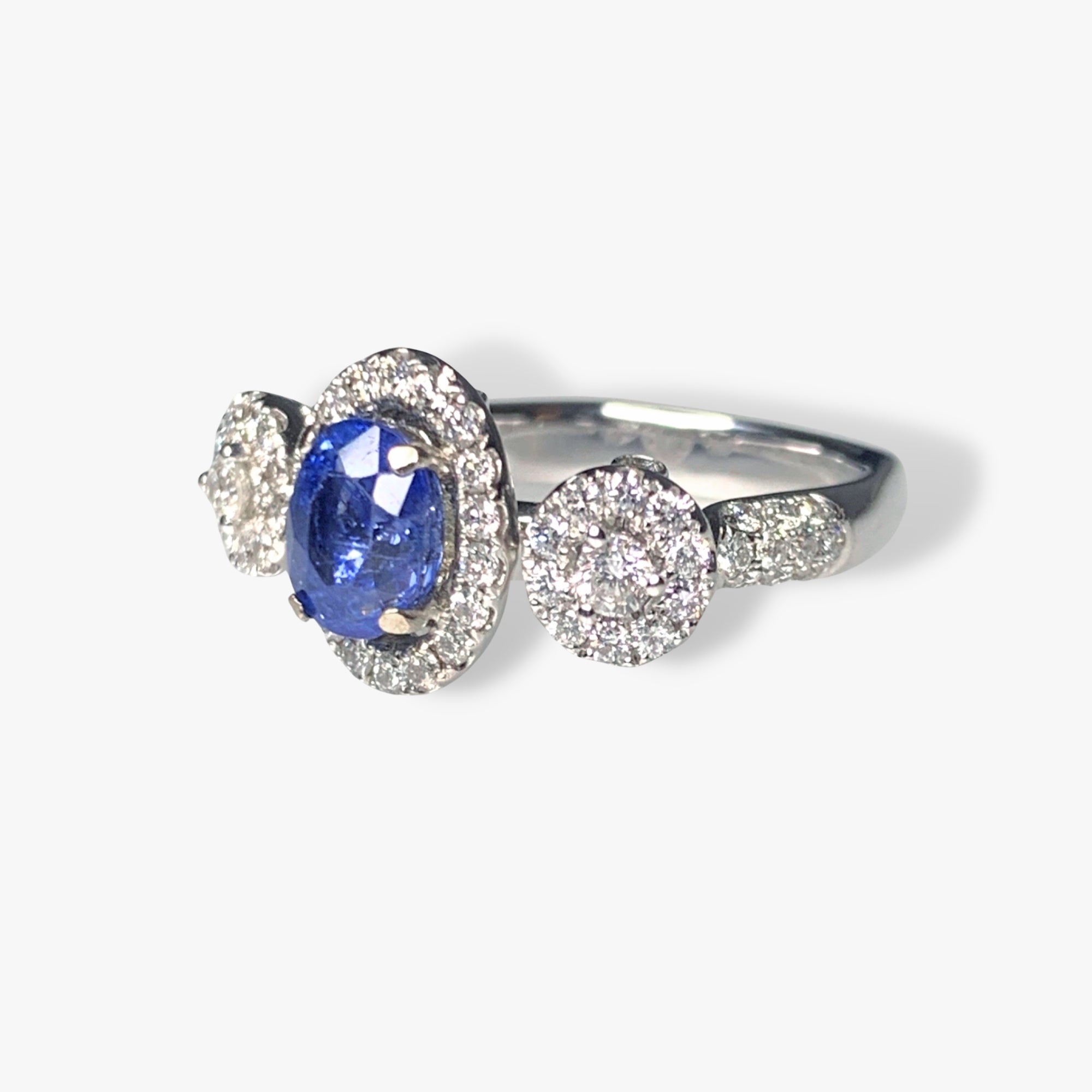 18k White Gold Oval Blue Sapphire and Diamond Three-Stone Halo Ring Side View