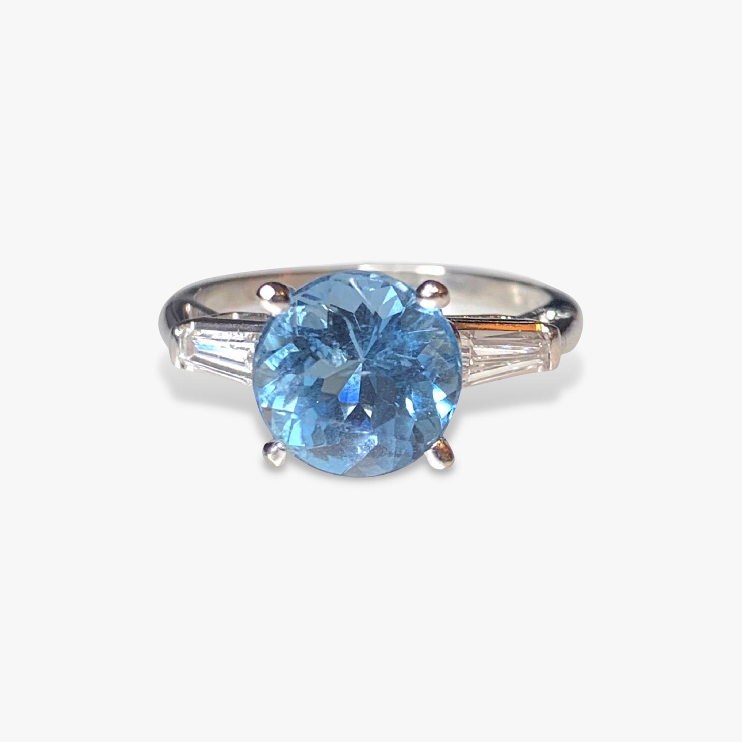 Platinum Round Aquamarine and Tapered Baguette Diamond Three-Stone RingPlatinum Round Aquamarine and Tapered Baguette Diamond Three-Stone Ring